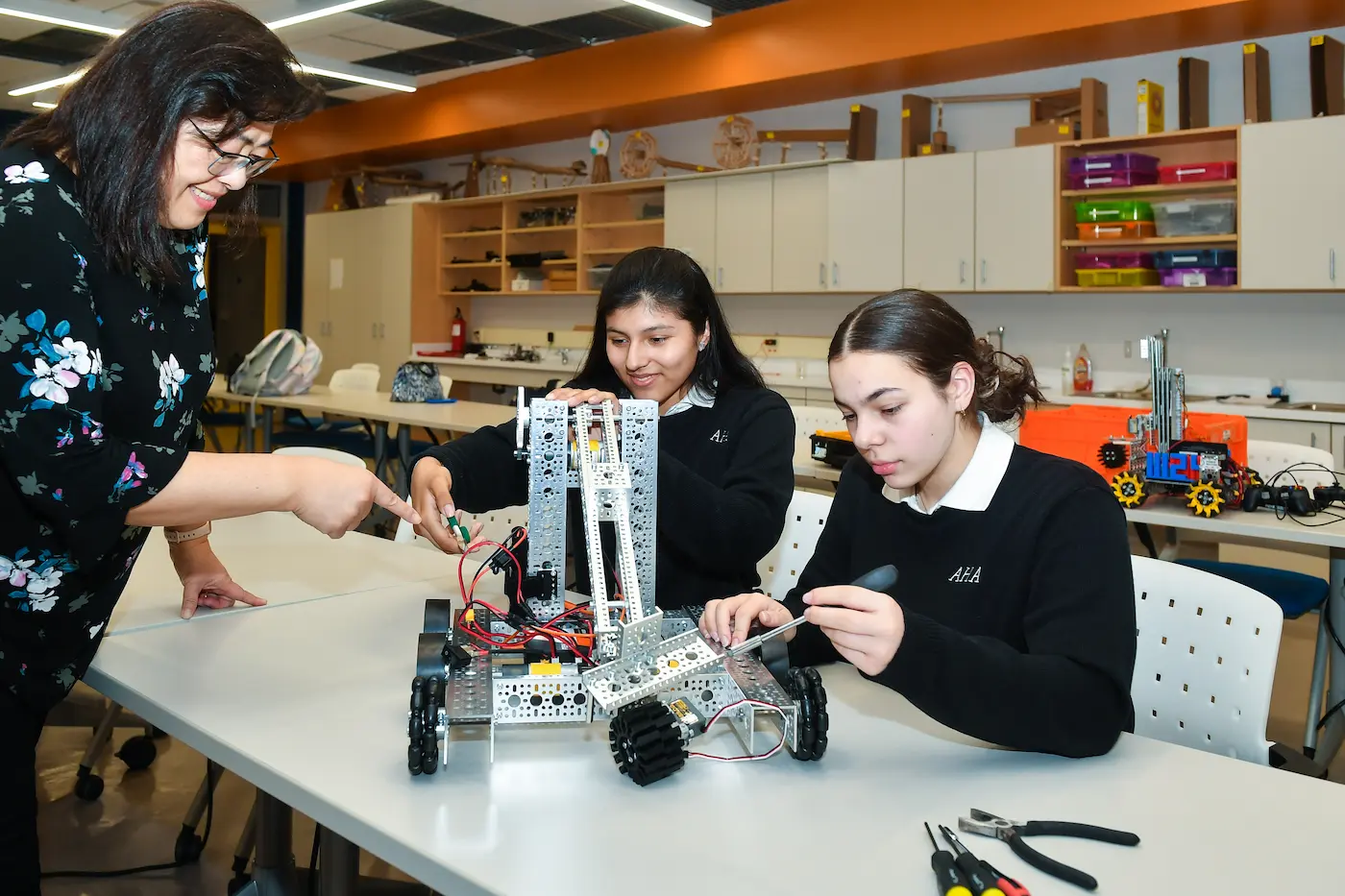 AHA Students working together in a Robotics Lab
